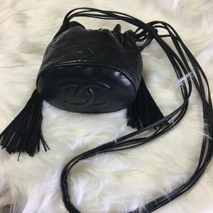 Drawstring CHANEL tassel mini bucket lamb skin.